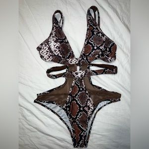 One piece snake print bathing swim suit. New without tags. Size L
